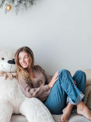 woman with a white teddy bear for Christmas