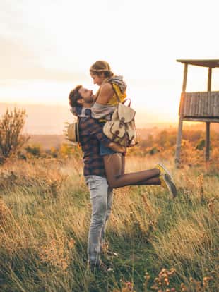 Couple enjoying a sunny day in late summer outdoors in nature