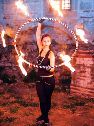 Fire juggler performing at night