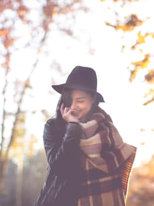 Happiness, woman with hat in autumn