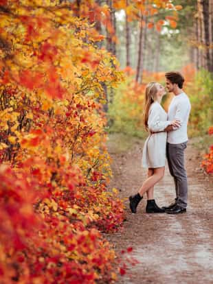 autumn love, couple kissing in fall park, happy man and woman outside