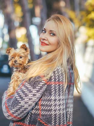 Beautiful blonde posing with her little dog