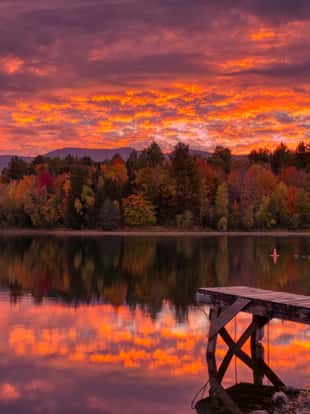 Sunrise after overnight storm in Fall at Waterbury Center State Park, Vermont, USA
