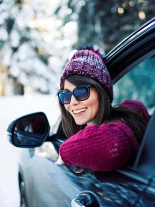 Women by car on winter