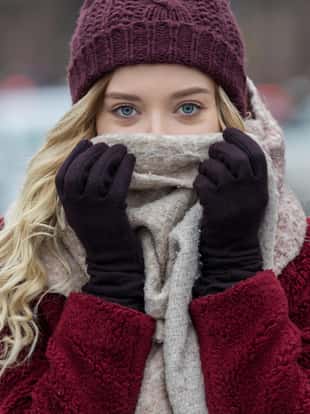 Young woman feeling cold in winter