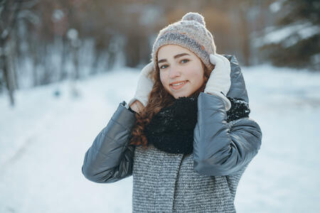 girl walks in winter and the sunny park
