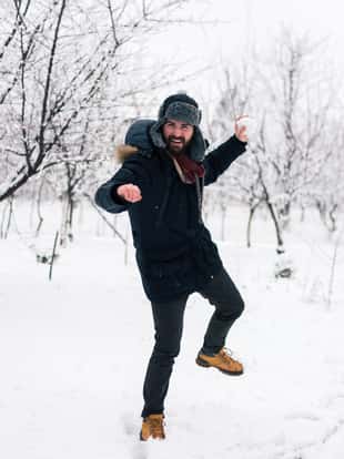 Handsome bearded man enjoying winter day during his vacation