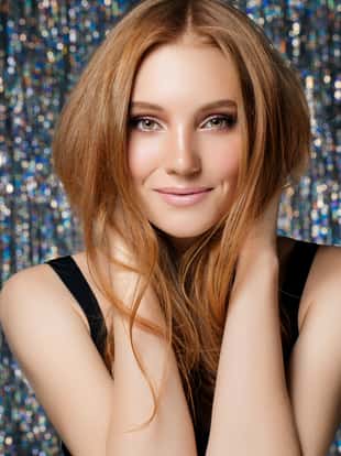 Studio shot of young beautiful woman on light background