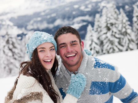 Young couple get playful in the snow