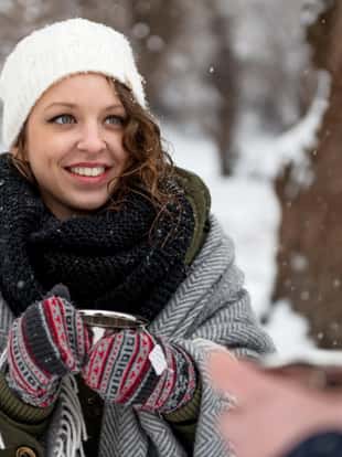 Young caucasian woman drinking hot tea