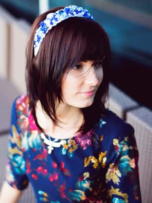 Portrait of the summer woman in a flower headband