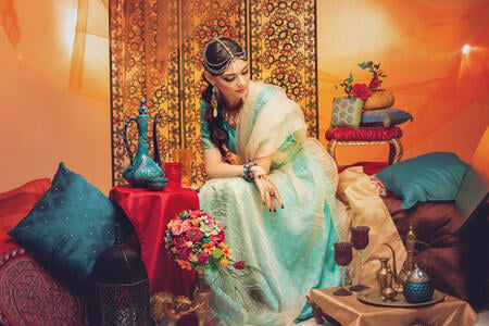 beautiful arabic style bride in ethnic clothes. studio shot. copy space.