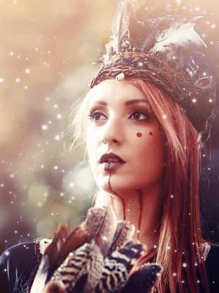 beautiful shamanic woman with headband in the nature