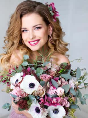 Beauty woman with Flowers. Hair. Bride. Perfect Creative Make up and Hair Style. Hairstyle.