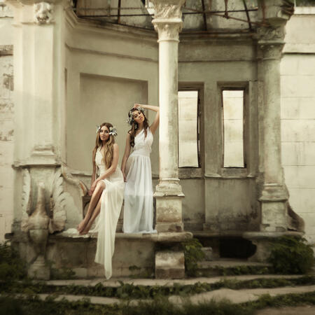 Two young attractive beautiful blonde woman in greek style.  grain and texturer added