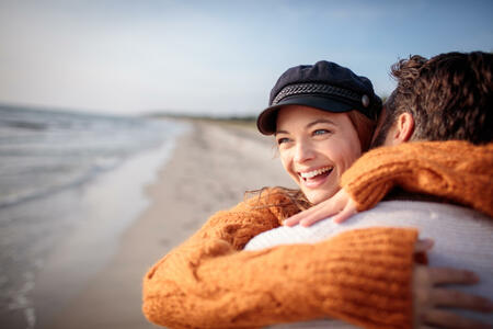 Close up of a young couple enjoying time on the beach