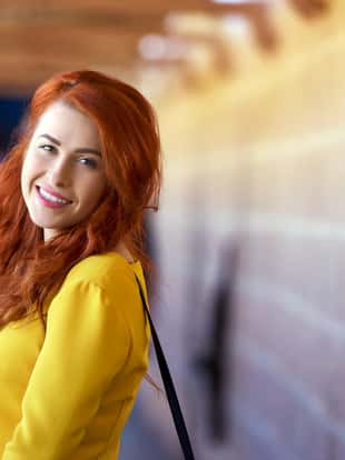 woman portrait in casual dress walking in city and relaxing, casual yellow dress.outdoor shoot.