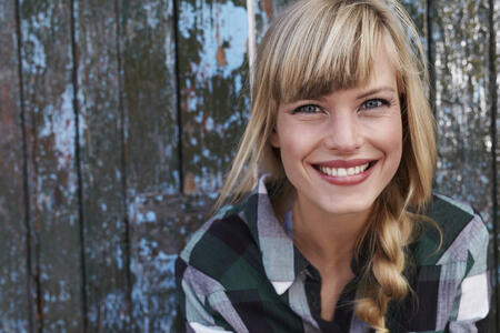 Beautiful smiling young blond woman, portrait