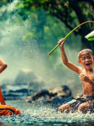 Childrens playing in the river