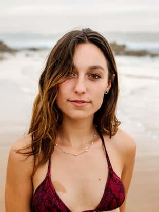 Portrait of a beautiful young woman on the beach
