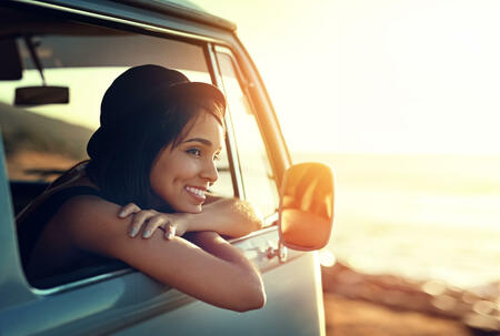 Shot of a young woman enjoying a relaxing roadtrip