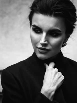 black and white portrait of a beautiful woman. Outdoor street photoshoot. Vogue style