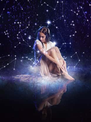photo art, young woman dreams to the starry sky. Elements of this image furnished by NASA.